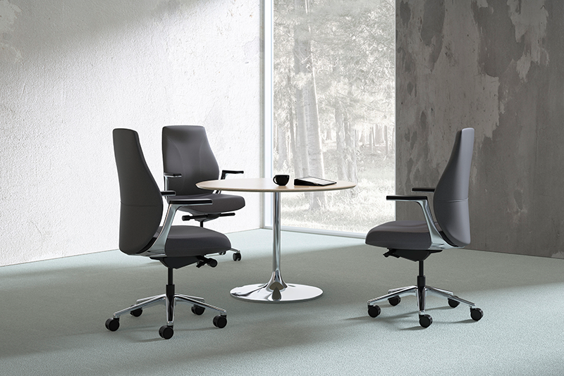 Unity 6961 mid back executive conference chairs around a table in a meeting space