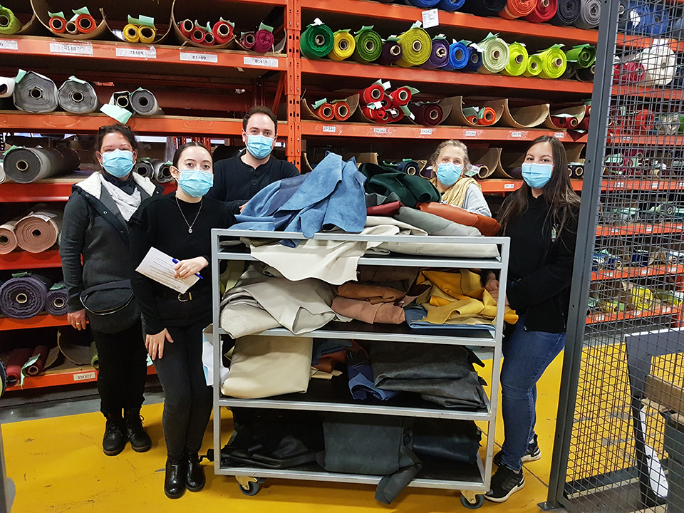 Keilhauer employees and IACC members pose with textile donations