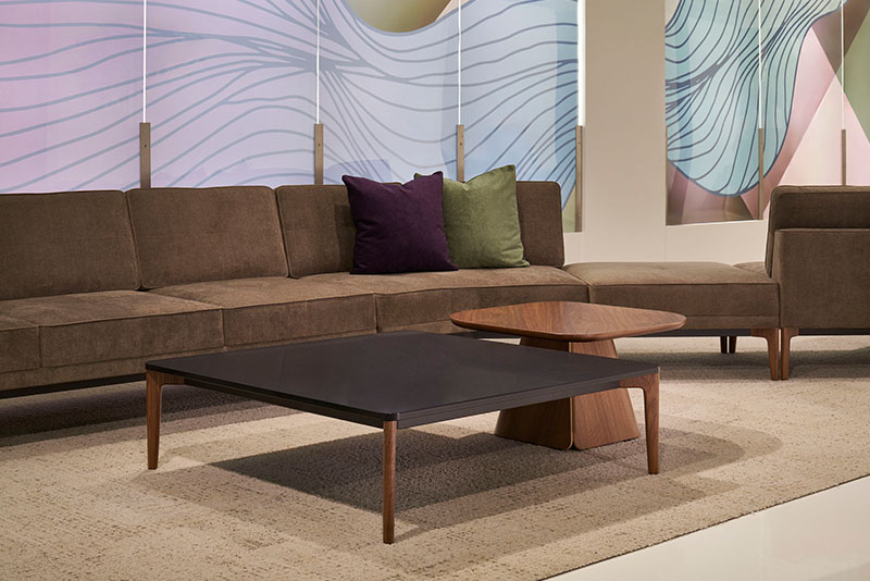 Fold square occasional table with the Symm square occasional table in front of the Symm modular sofa