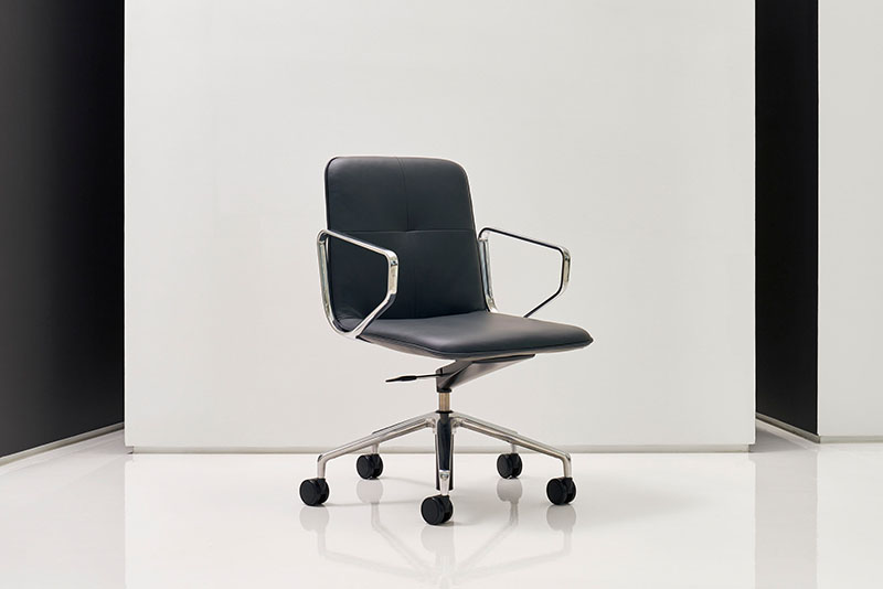 Swav low back conference chair in front of a white wall