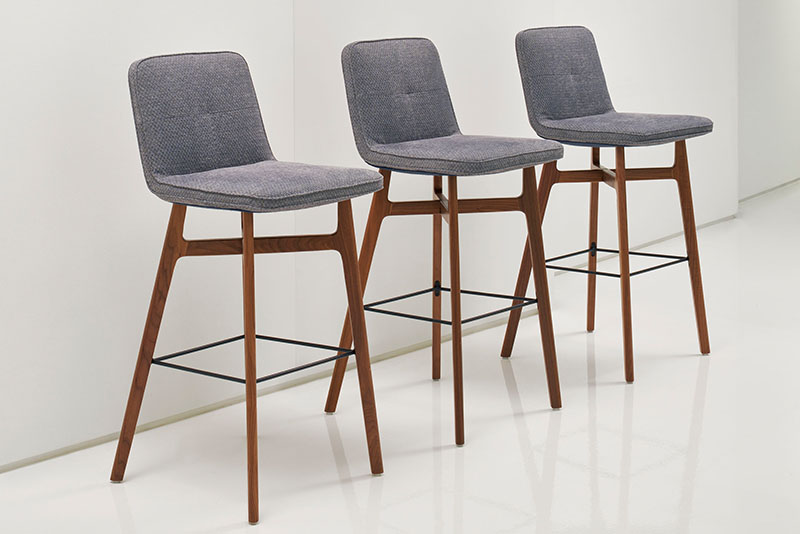 Three Swav bar stools in a line on a white background